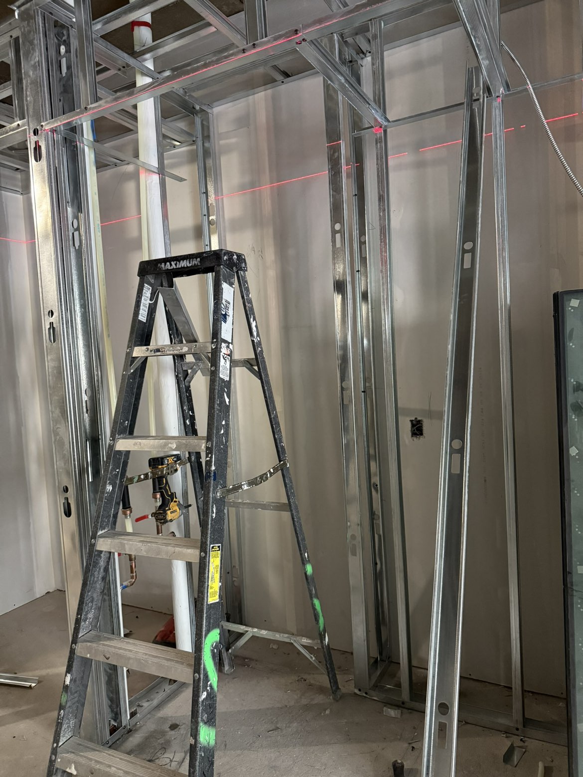 Boarded walls and staged steel stud