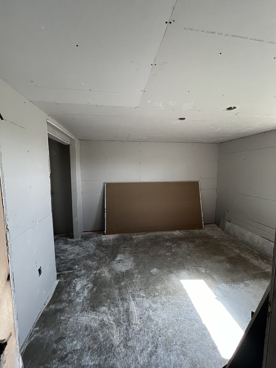 Boarded basement bedroom